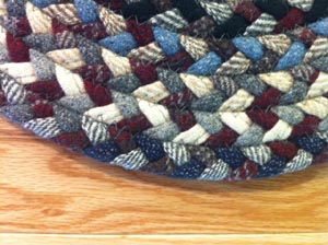 A braided rug made from cloth. Cloth is more durable than yarn.  These braids last a long, long time.