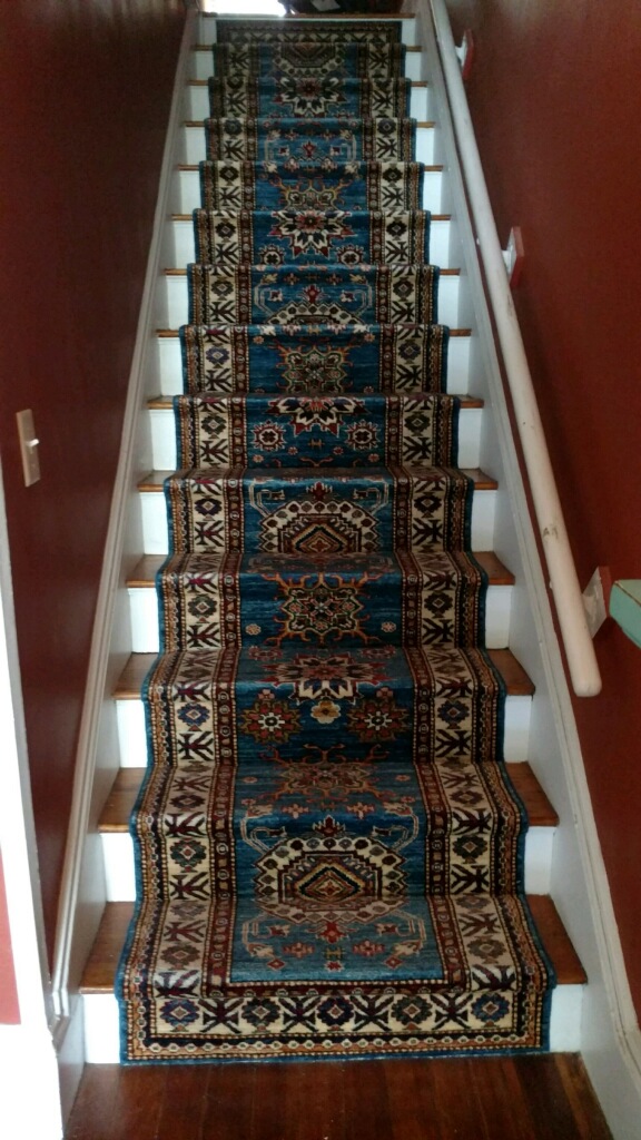 A hand-knotted oriental runner.